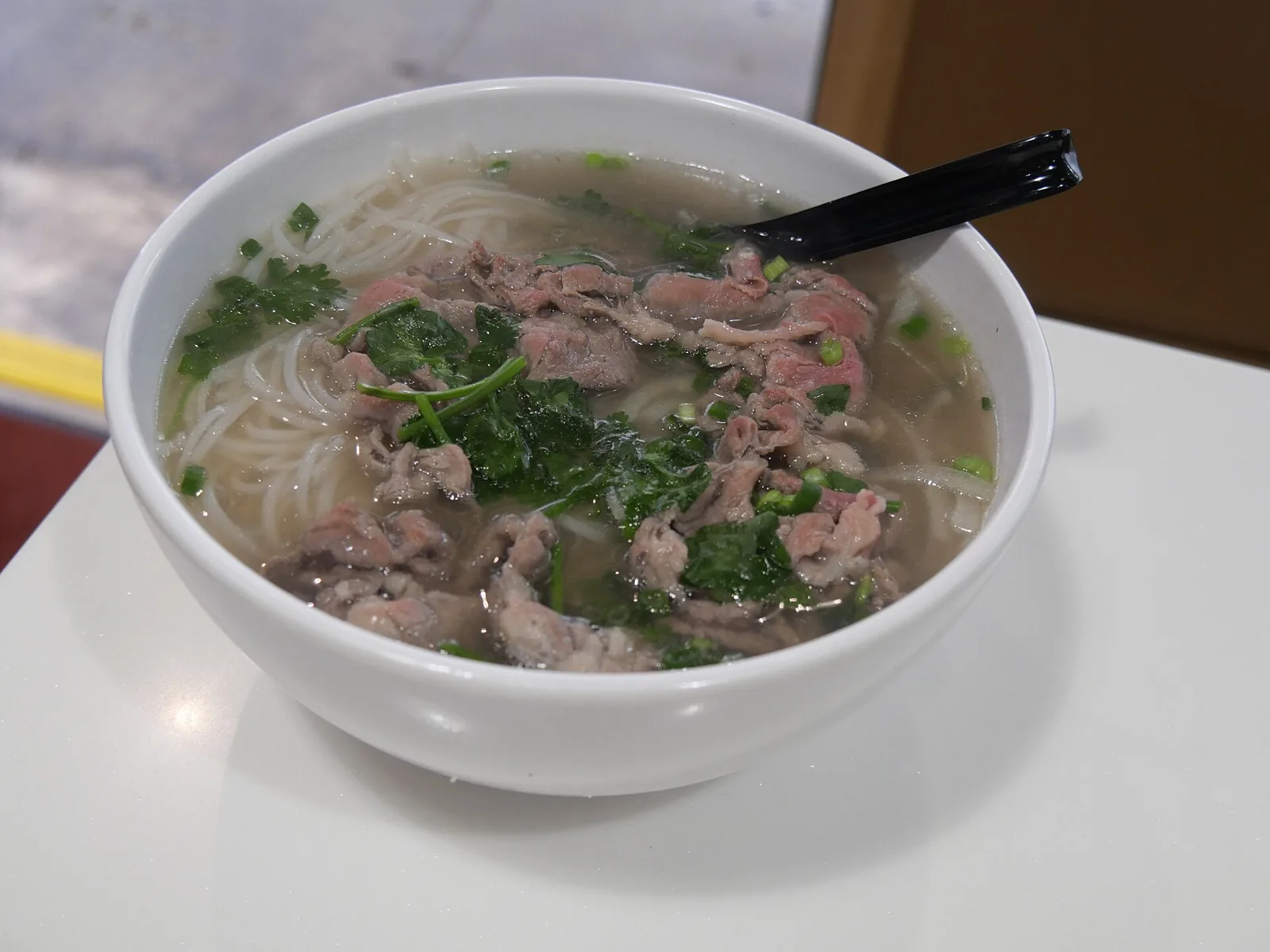 A large bowl of beef pho