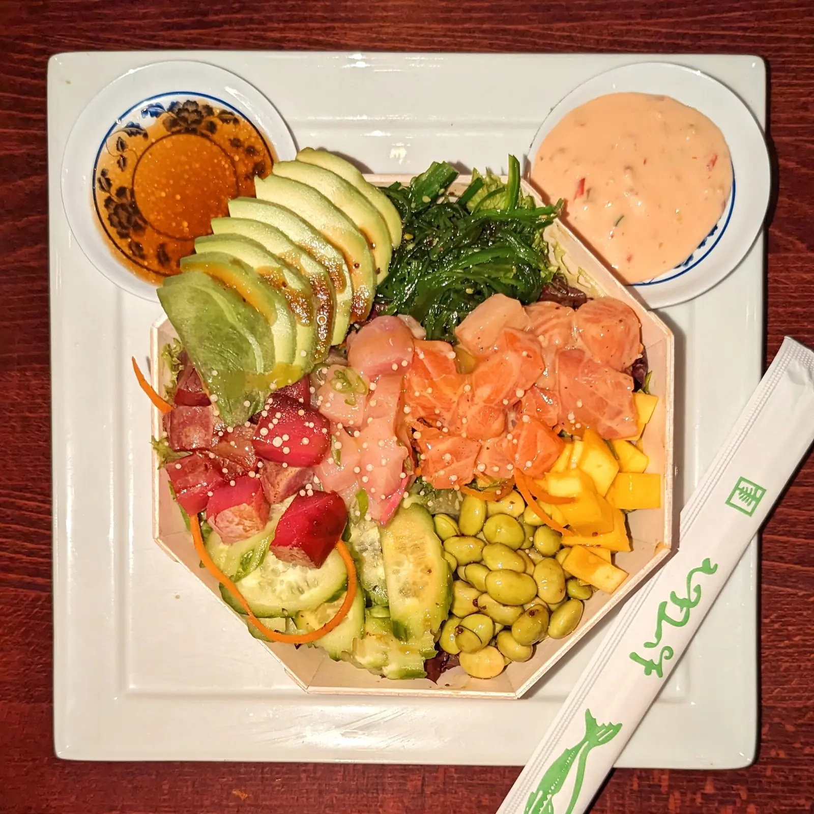 A poke plate with salmon and avocado